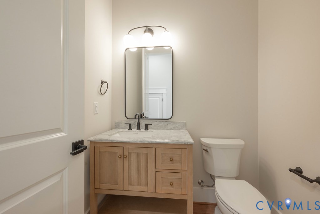 3530 Old Gun Road West Midlothian, VA 23113 - Photo 24 of 50 a bathroom with a granite countertop toilet sink and mirror