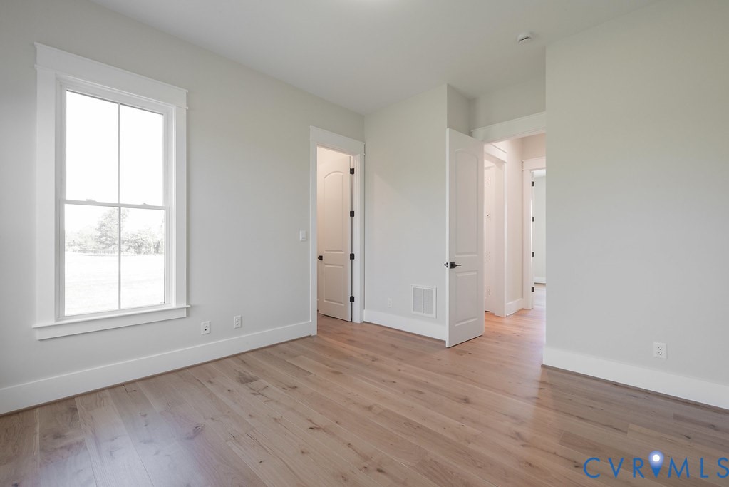 3530 Old Gun Road West Midlothian, VA 23113 - Photo 36 of 50 an empty room with wooden floor and windows