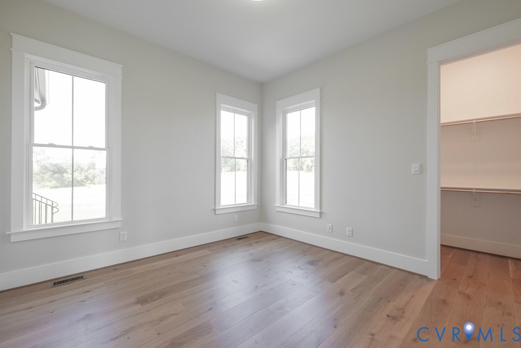 3530 Old Gun Road West Midlothian, VA 23113 - Photo 38 of 50 an empty room with wooden floor and windows