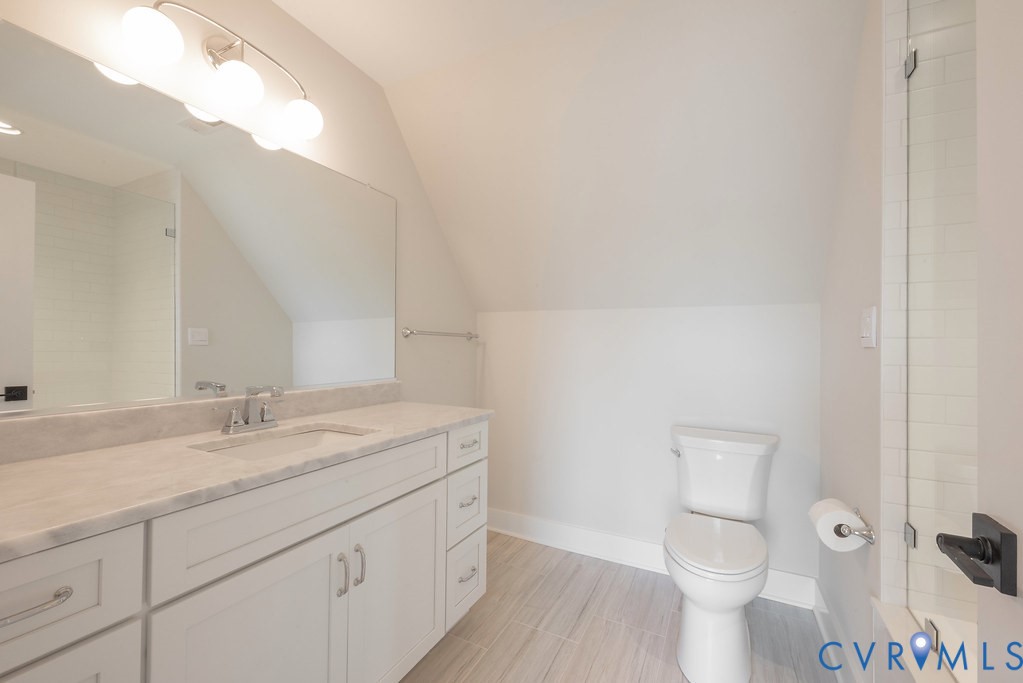 3530 Old Gun Road West Midlothian, VA 23113 - Photo 45 of 50 a bathroom with a granite countertop sink a toilet and a mirror
