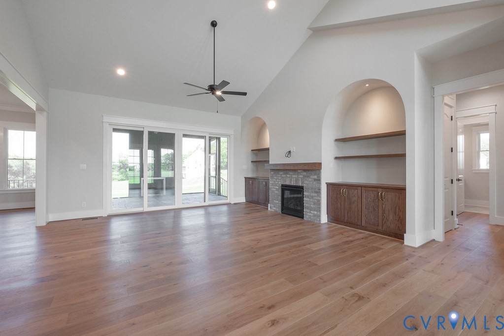 3530 Old Gun Road West Midlothian, VA 23113 - Photo 9 of 50 a view of an empty room with wooden floor and a window