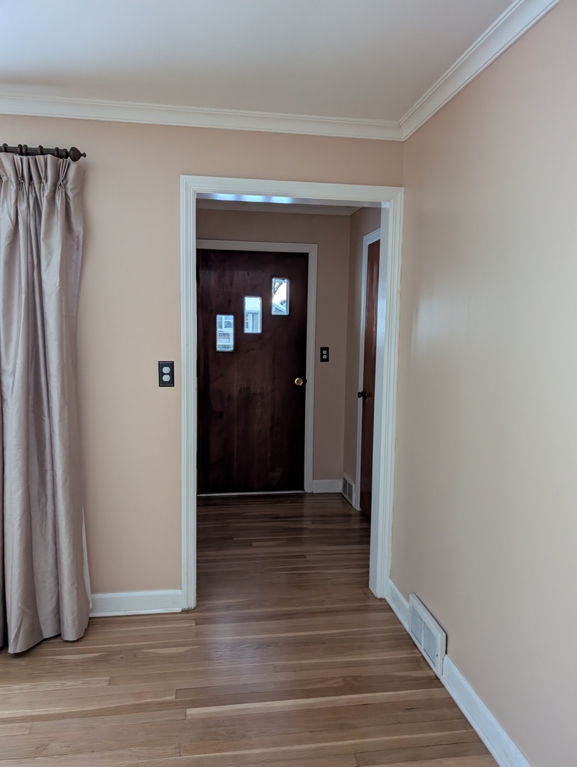 3618 Maple Avenue McHenry, IL 60050 - Photo 7 of 15 a view of a hallway with wooden floor and closet area