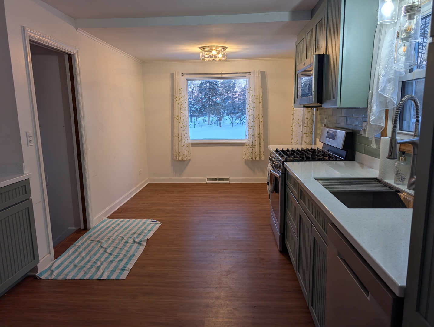 3618 Maple Avenue McHenry, IL 60050 - Photo 10 of 15 a kitchen with a sink stove and cabinets