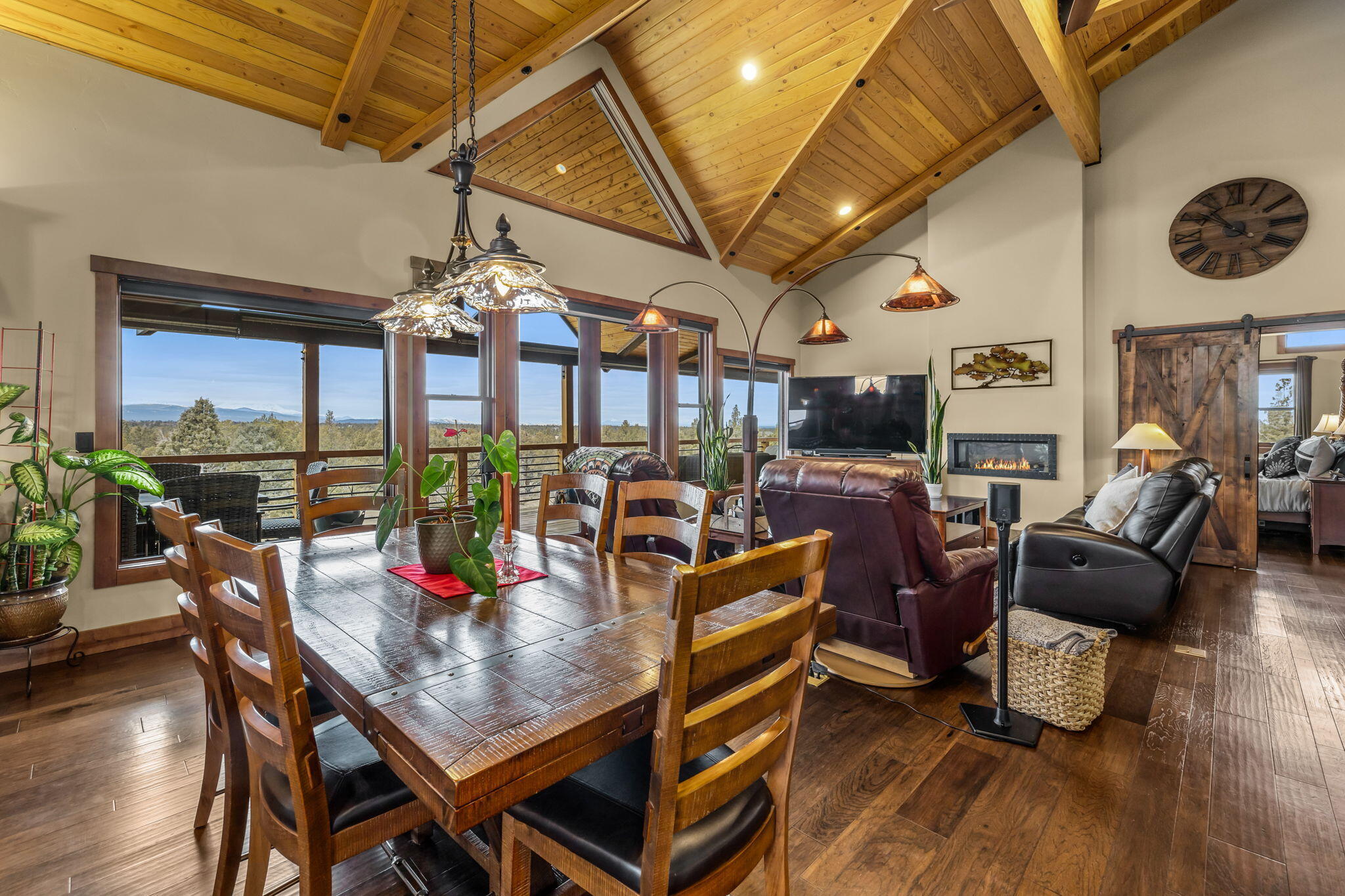 23150 Rickard Road Bend, OR 97702 - Photo 9 of 60 a view of a dining room with furniture window and wooden floor