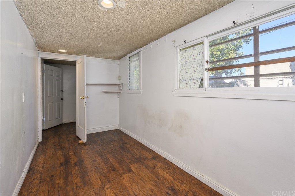 355 West Spruce Street Compton, CA 90220 - Photo 13 of 27 a view of hallway with a large window and wooden floor