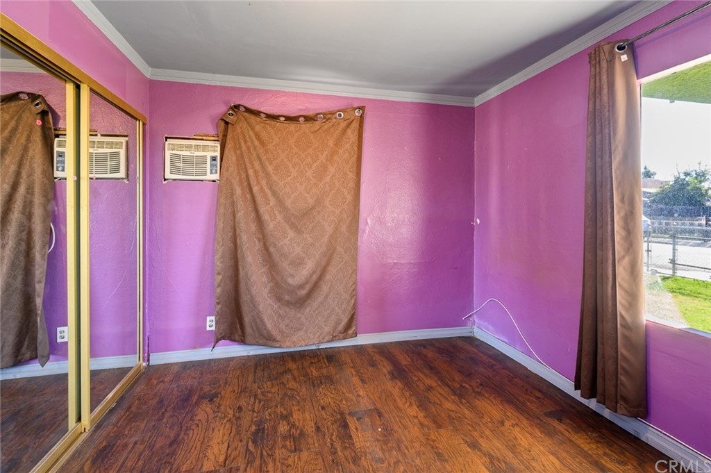 355 West Spruce Street Compton, CA 90220 - Photo 15 of 27 a view of a red door and wooden floor in a room
