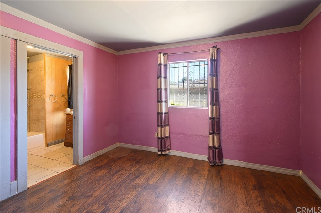 355 West Spruce Street Compton, CA 90220 - Photo 17 of 27 an empty room with wooden floor and windows