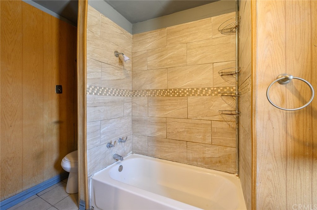 355 West Spruce Street Compton, CA 90220 - Photo 20 of 27 a bathroom with a bathtub and a shower