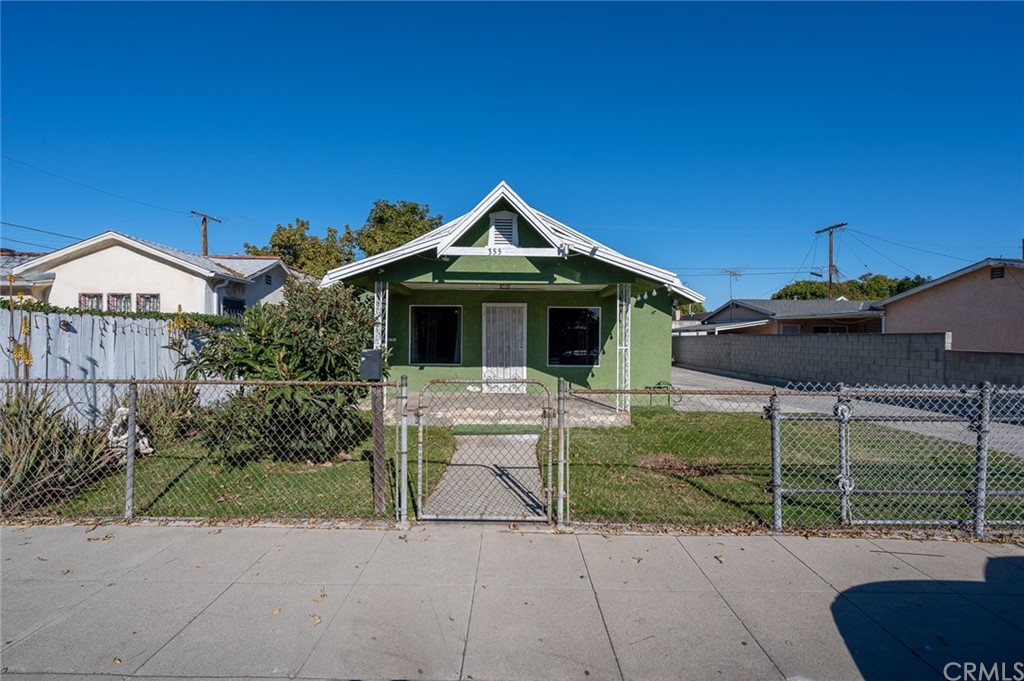 355 West Spruce Street Compton, CA 90220 - Photo 2 of 27 a front view of a house with a porch