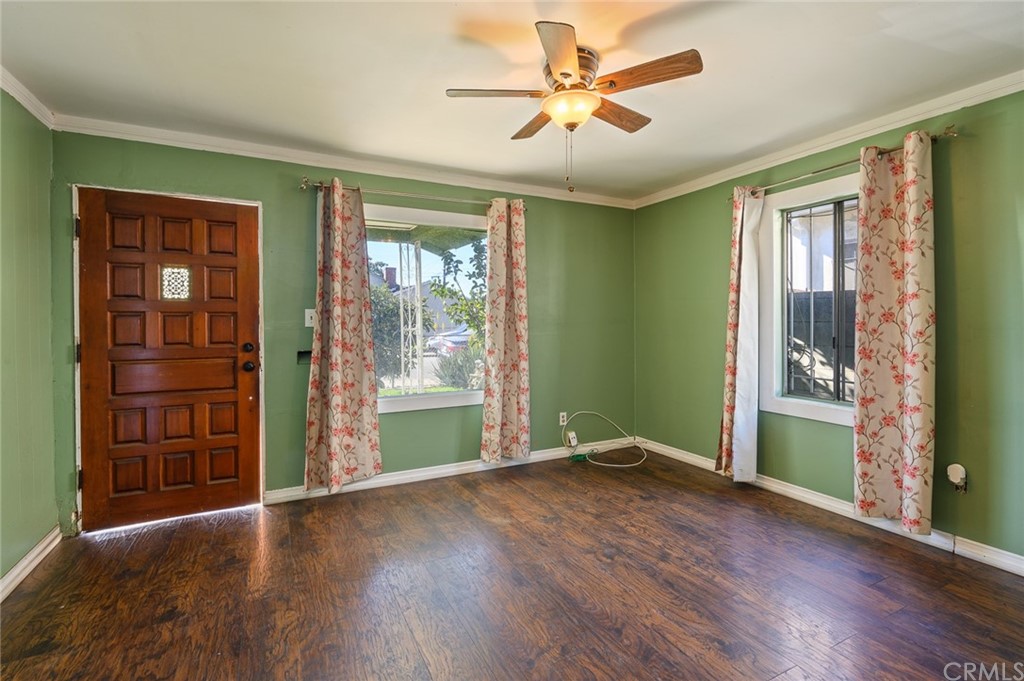 355 West Spruce Street Compton, CA 90220 - Photo 4 of 27 wooden floor in an empty room with a window