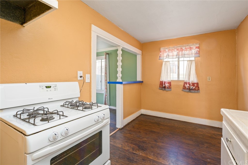 355 West Spruce Street Compton, CA 90220 - Photo 10 of 27 a kitchen with a stove and a refrigerator