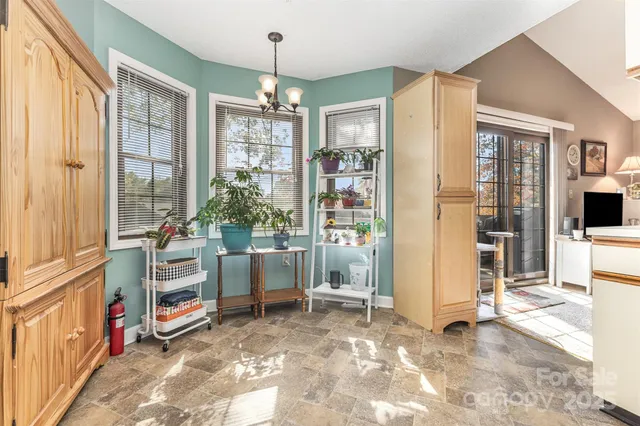 a view of a livingroom with furniture and windows