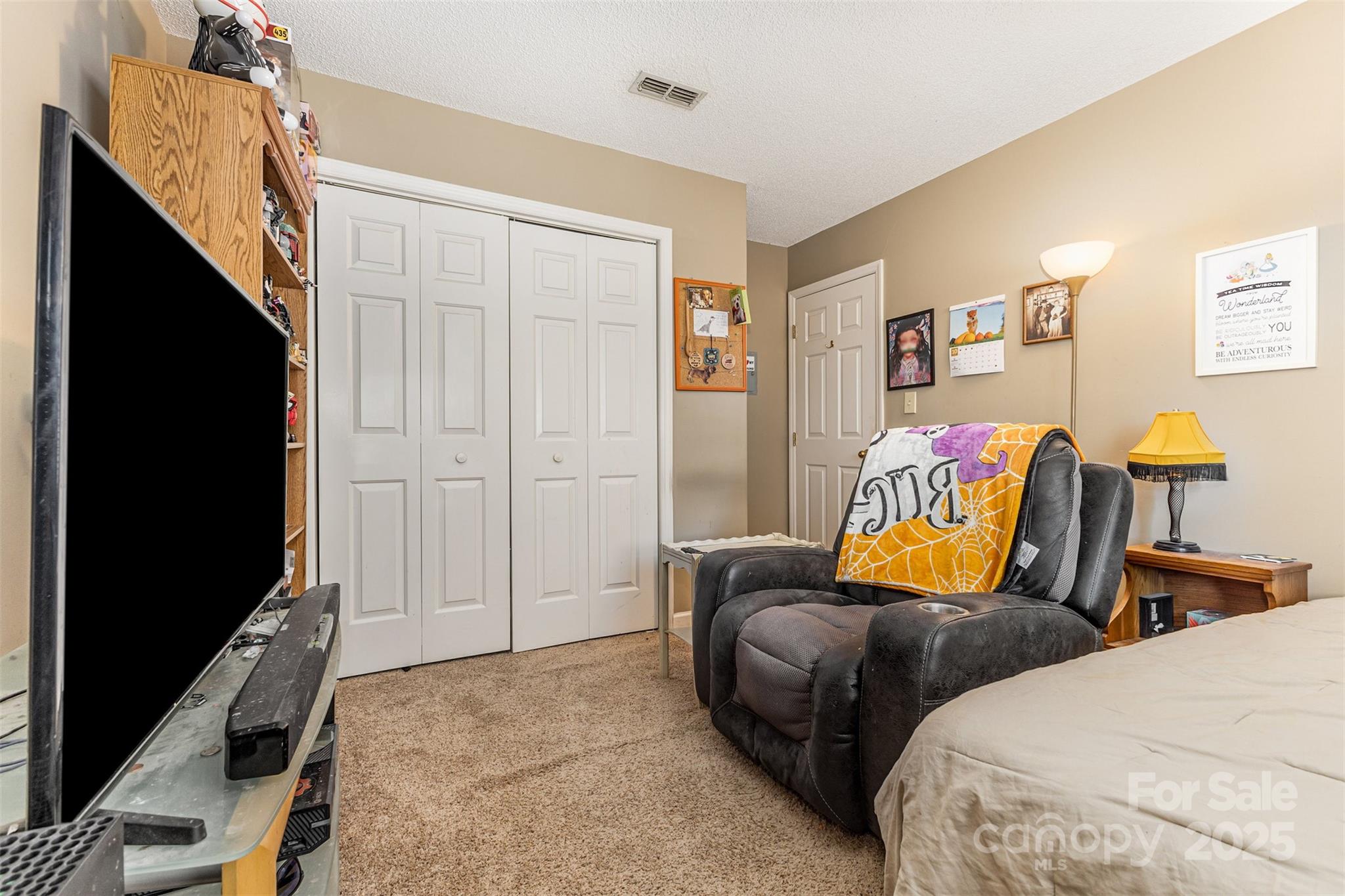 2762 Victory Court, Unit F8 Fort Mill, SC 29715 - Photo 19 of 27 a bedroom with two beds and painting on the wall