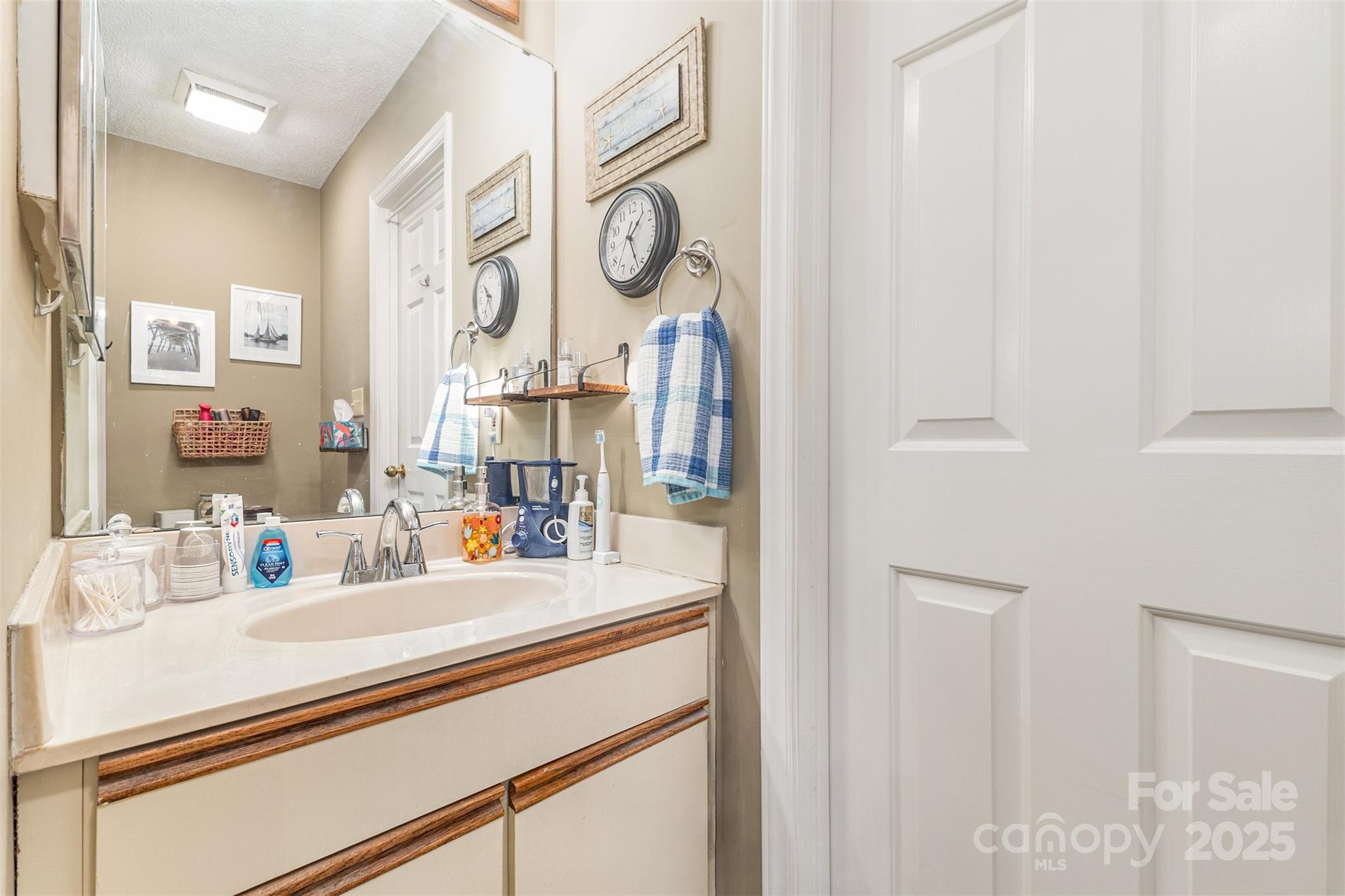 2762 Victory Court, Unit F8 Fort Mill, SC 29715 - Photo 20 of 27 a bathroom with a sink and a mirror