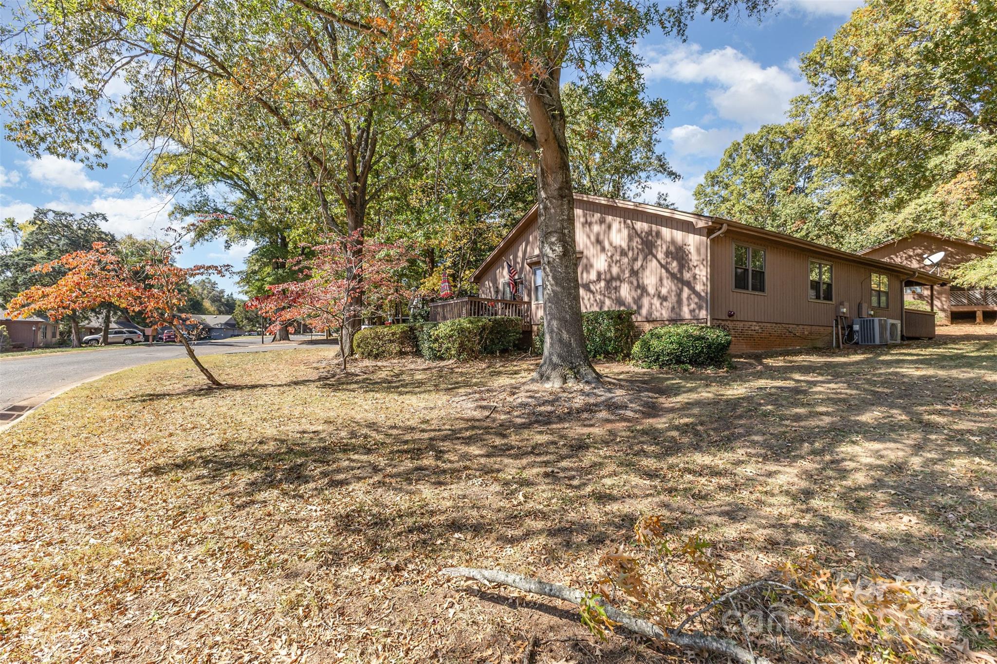 2762 Victory Court, Unit F8 Fort Mill, SC 29715 - Photo 23 of 27 a backyard of a house with lots of green space