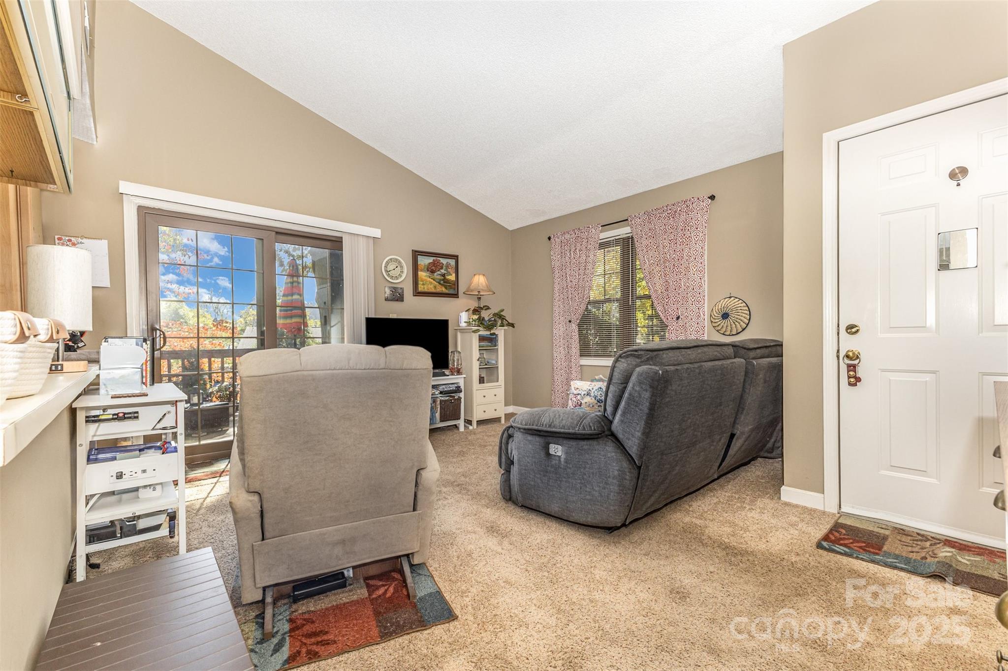 2762 Victory Court, Unit F8 Fort Mill, SC 29715 - Photo 7 of 27 a living room with furniture and a flat screen tv