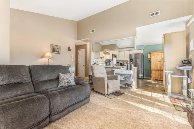 a living room with furniture and a table