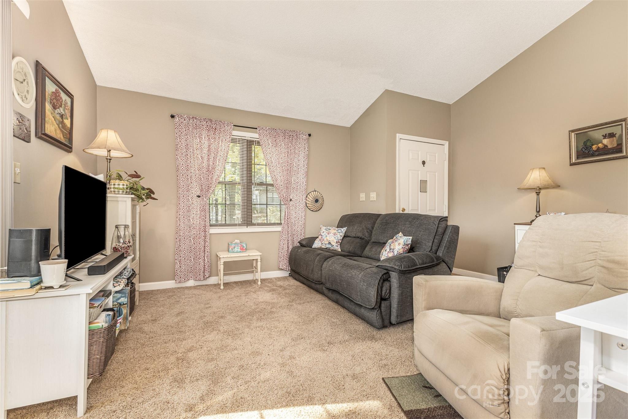 2762 Victory Court, Unit F8 Fort Mill, SC 29715 - Photo 10 of 27 a living room with furniture and a flat screen tv