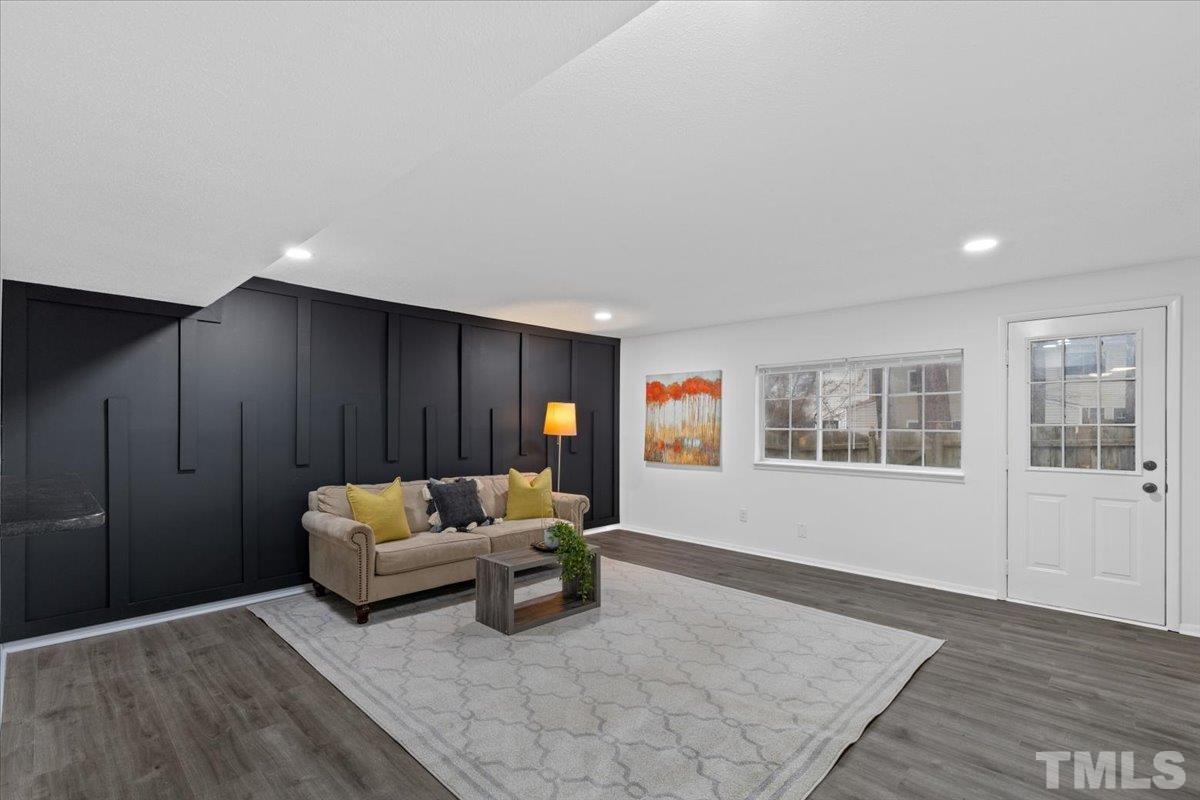 7721 Sandra Lane Raleigh, NC 27615 - Photo 11 of 29 a living room with furniture and window