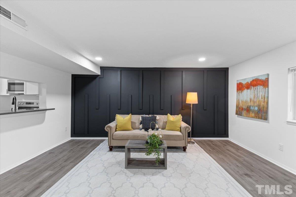 7721 Sandra Lane Raleigh, NC 27615 - Photo 12 of 29 a living room with furniture and a couch