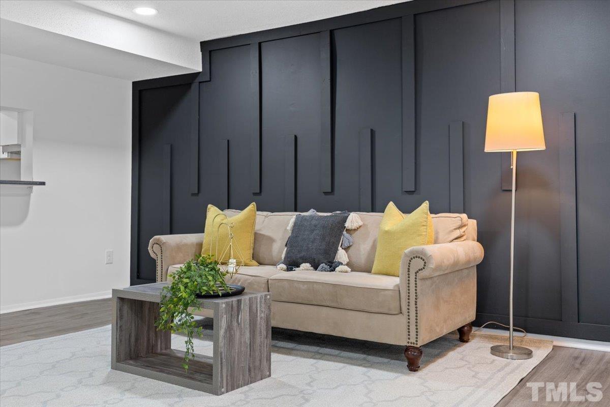 7721 Sandra Lane Raleigh, NC 27615 - Photo 13 of 29 a living room with furniture and wooden floor