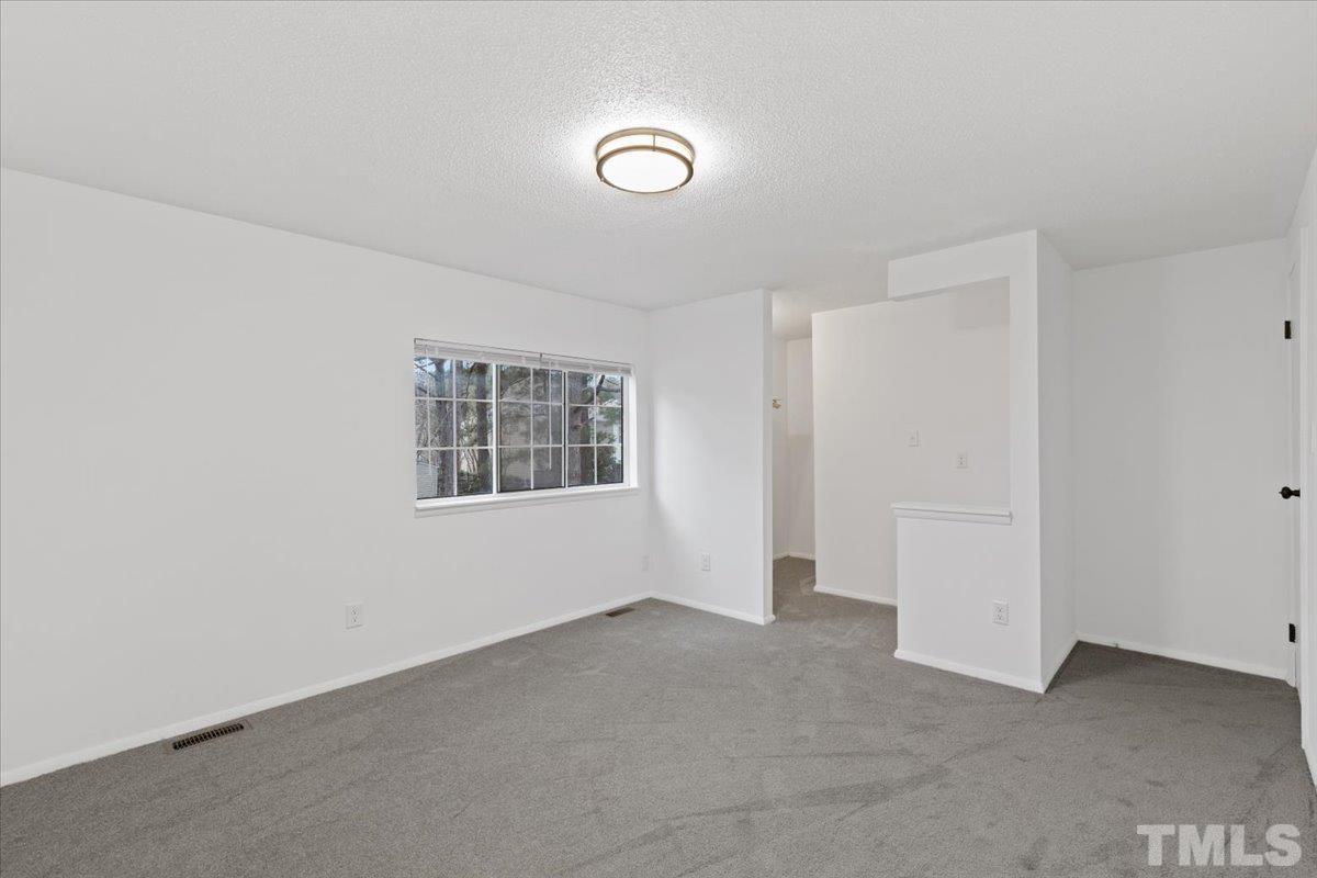 7721 Sandra Lane Raleigh, NC 27615 - Photo 17 of 29 an empty room with windows