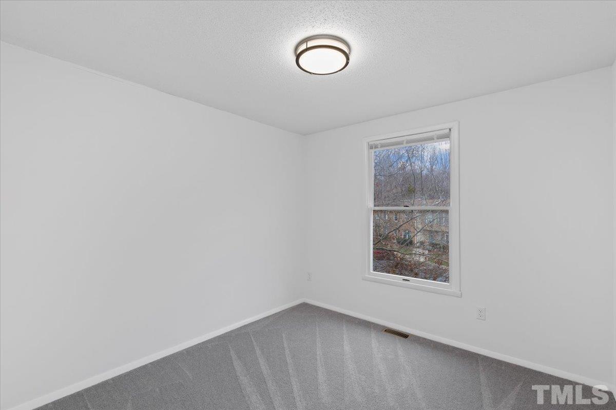 7721 Sandra Lane Raleigh, NC 27615 - Photo 22 of 29 an empty room with a window