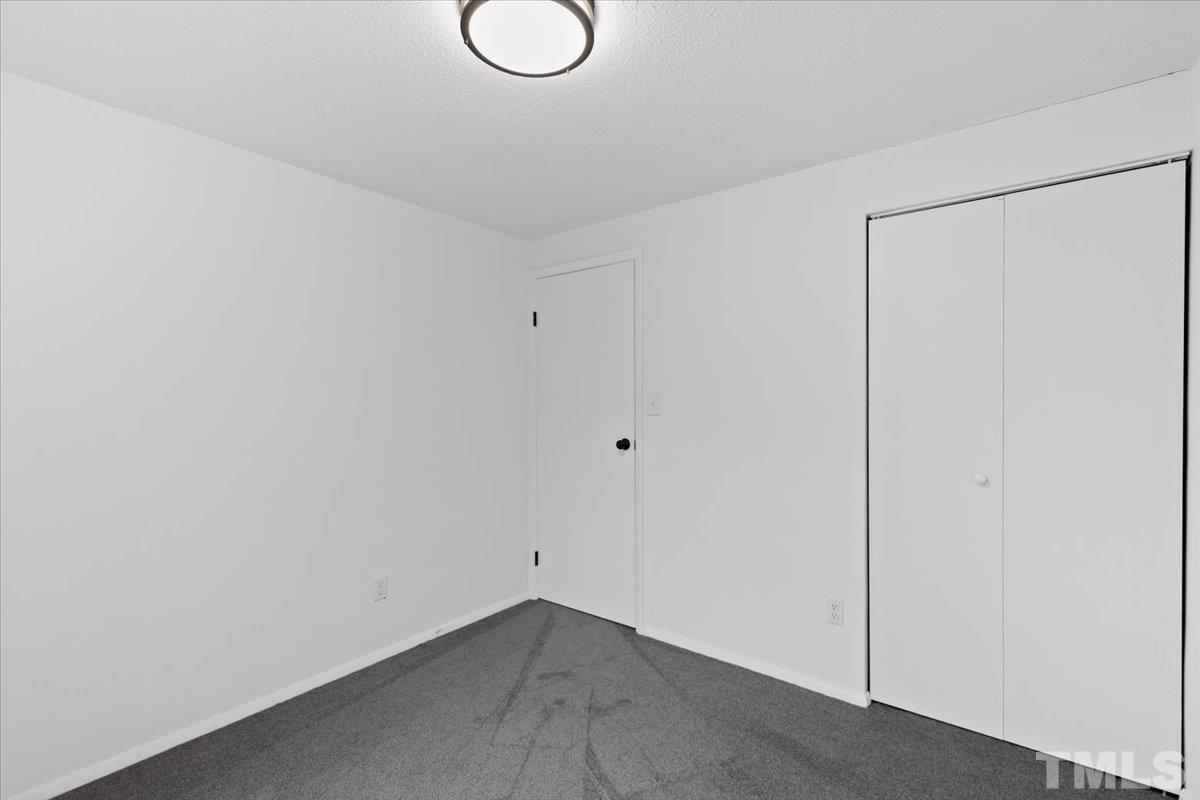 7721 Sandra Lane Raleigh, NC 27615 - Photo 24 of 29 a view of a room with wooden floor