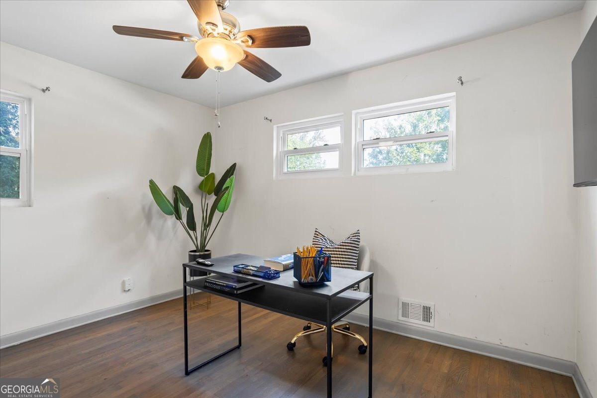 2316 Dorsey Avenue East Point, GA 30344 - Photo 21 of 25 a view of a workspace with furniture and a potted plant
