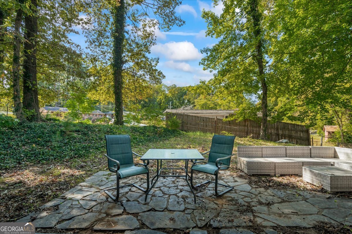 2316 Dorsey Avenue East Point, GA 30344 - Photo 25 of 25 a backyard of a house with outdoor seating