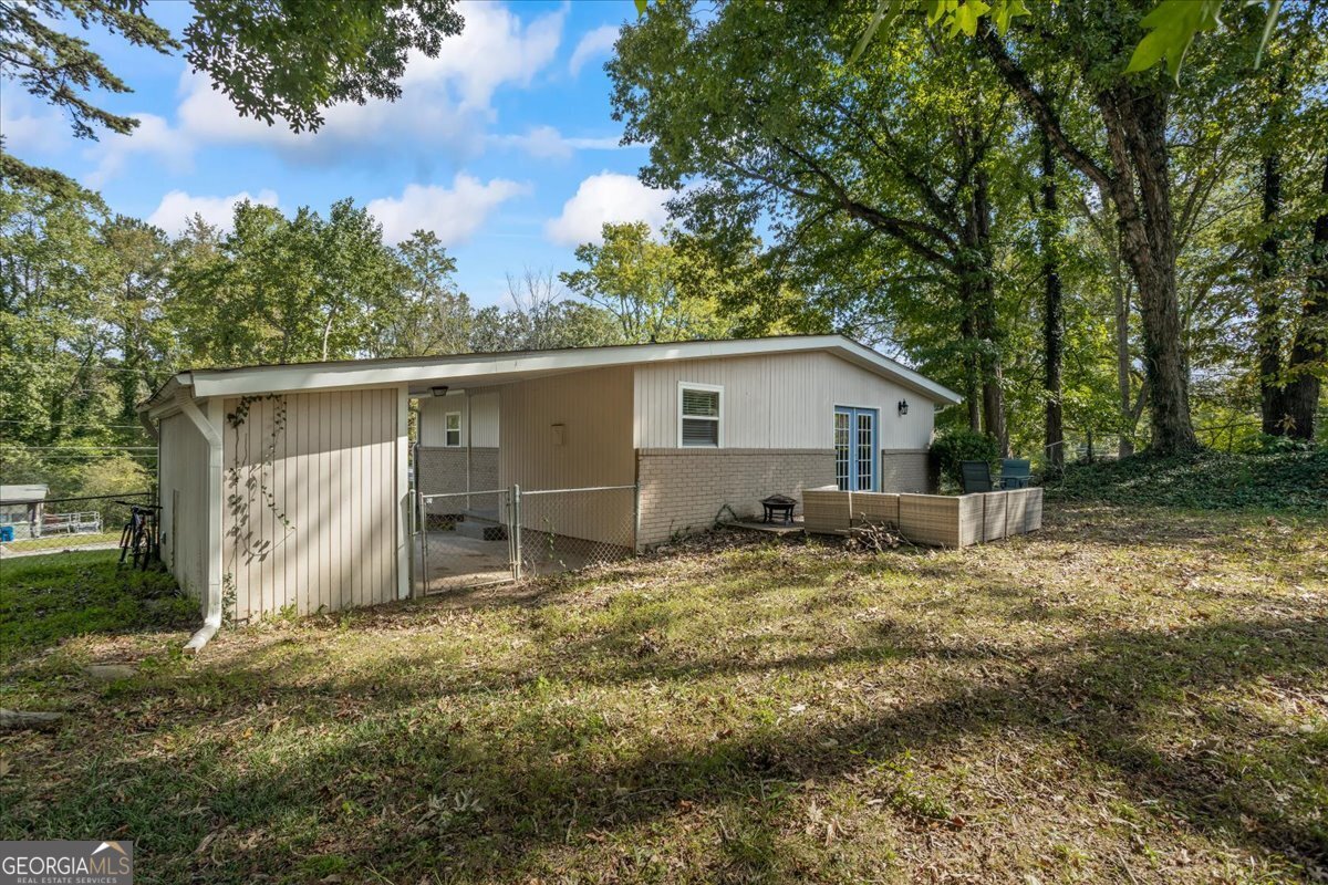 2316 Dorsey Avenue East Point, GA 30344 - Photo 6 of 25 a house view with backyard space and garden