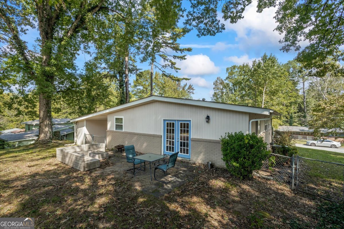2316 Dorsey Avenue East Point, GA 30344 - Photo 7 of 25 a backyard of a house with table and chairs