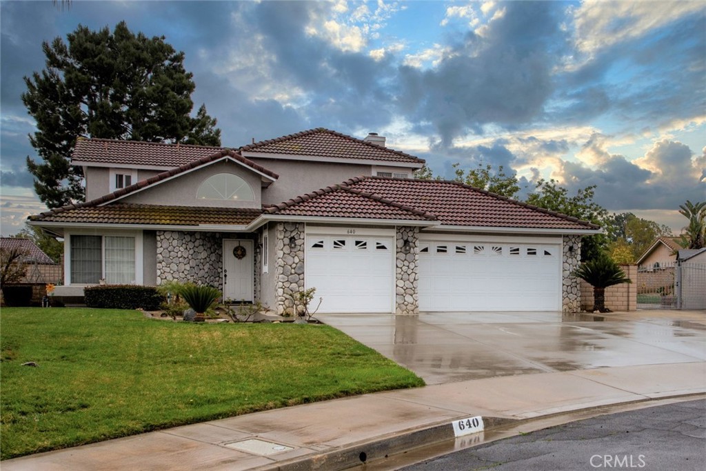640 Burwood Court Riverside, CA 92506 - Photo 1 of 1 a view of a white house with a yard and plants
