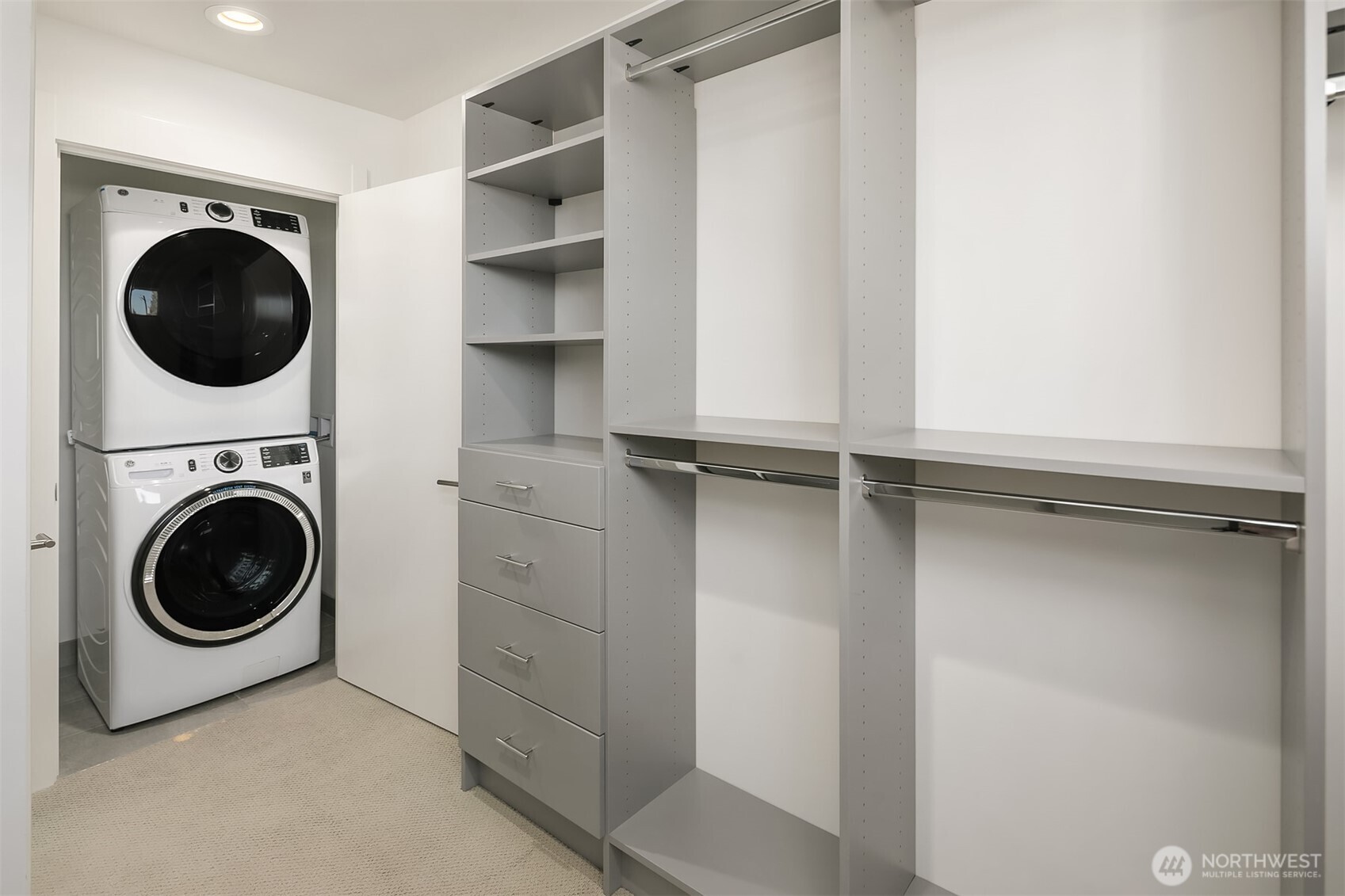 8305 12th Avenue Northwest, Unit C Seattle, WA 98117 - Photo 11 of 26 a view of a hallway with washer and dryer