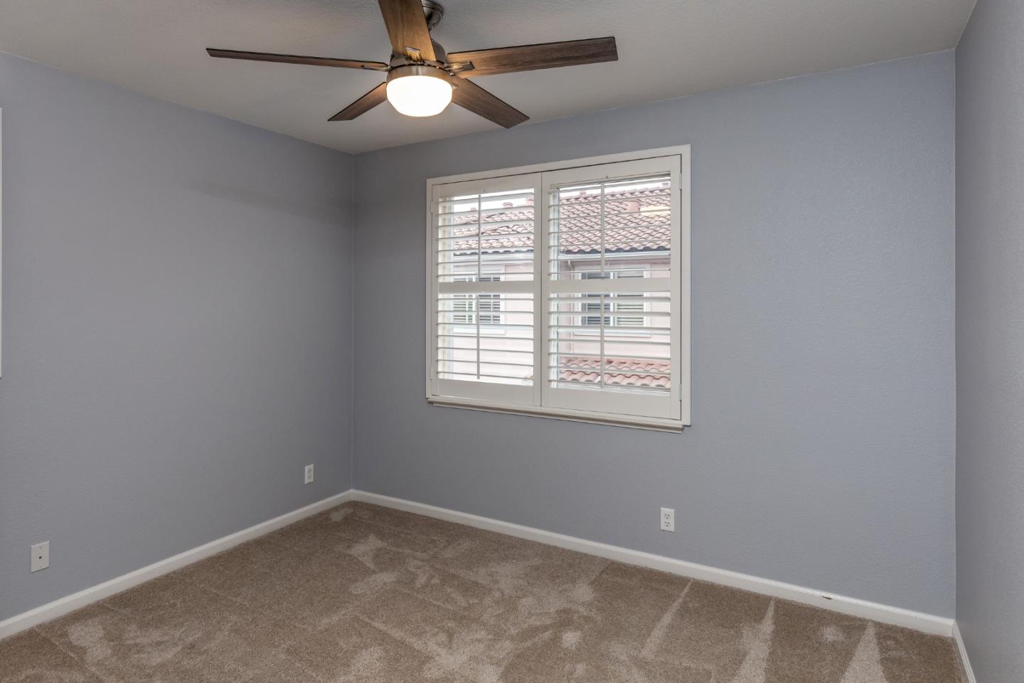 341 Vista Roma Way San Jose, CA 95136 - Photo 16 of 24 an empty room with a window and a fan