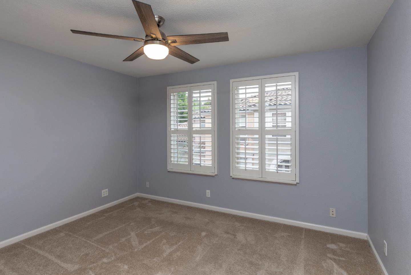 341 Vista Roma Way San Jose, CA 95136 - Photo 10 of 24 an empty room with a window and a fan