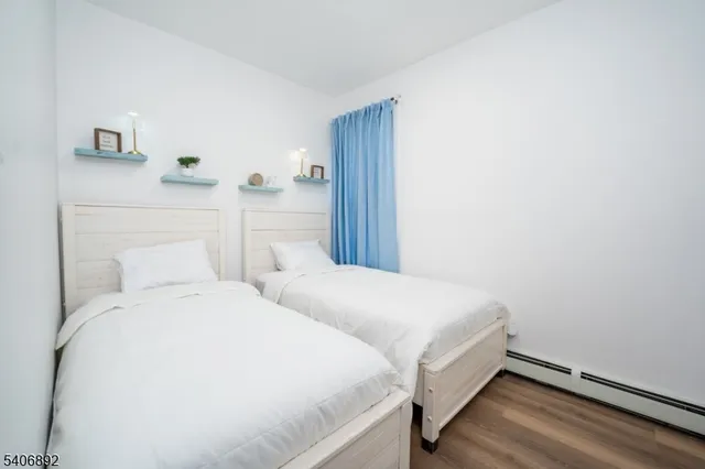 a large white bed in a white room