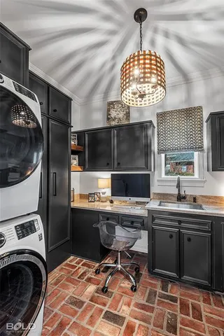 a kitchen with sink cabinets and window