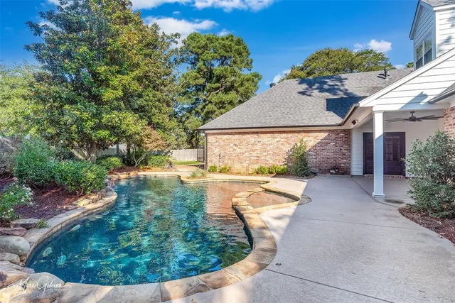 a view of a house with fountain bath tub and trees