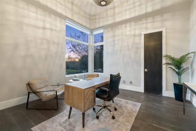 an aerial view of residential houses with outdoor space and street view