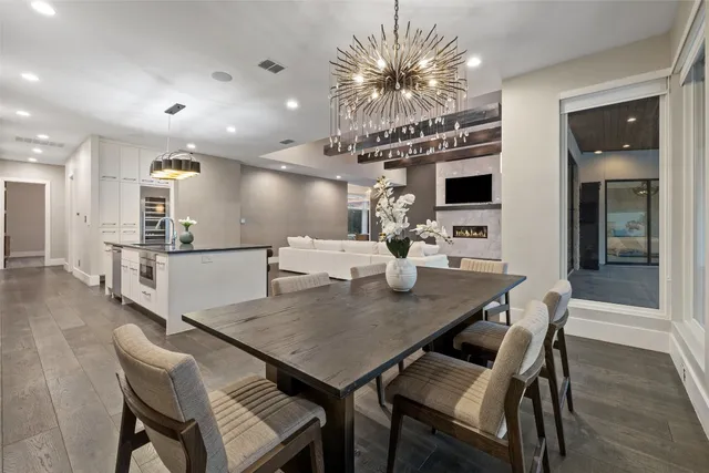 a kitchen with granite countertop a sink cabinets and stainless steel appliances