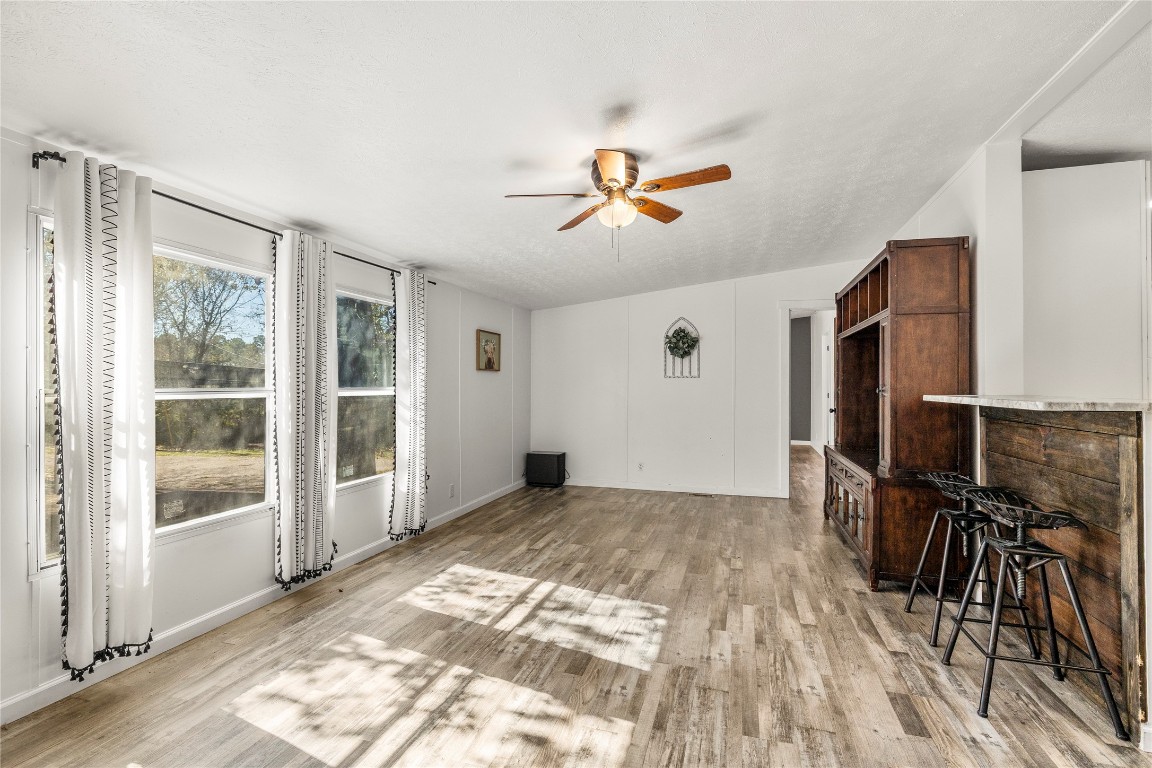 21150 Arnsworth Road Montgomery, TX 77356 - Photo 14 of 35 a view of workspace with wooden floor and windows