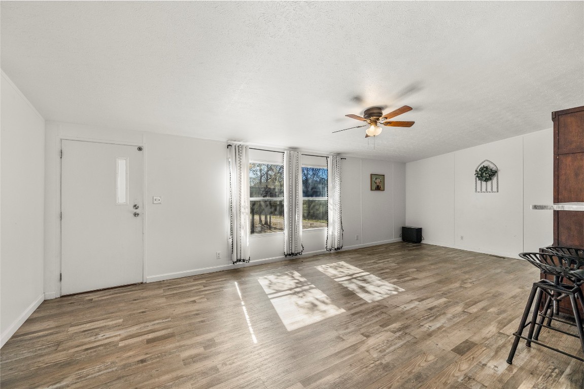 21150 Arnsworth Road Montgomery, TX 77356 - Photo 15 of 35 a view of a livingroom with a window and wooden floor