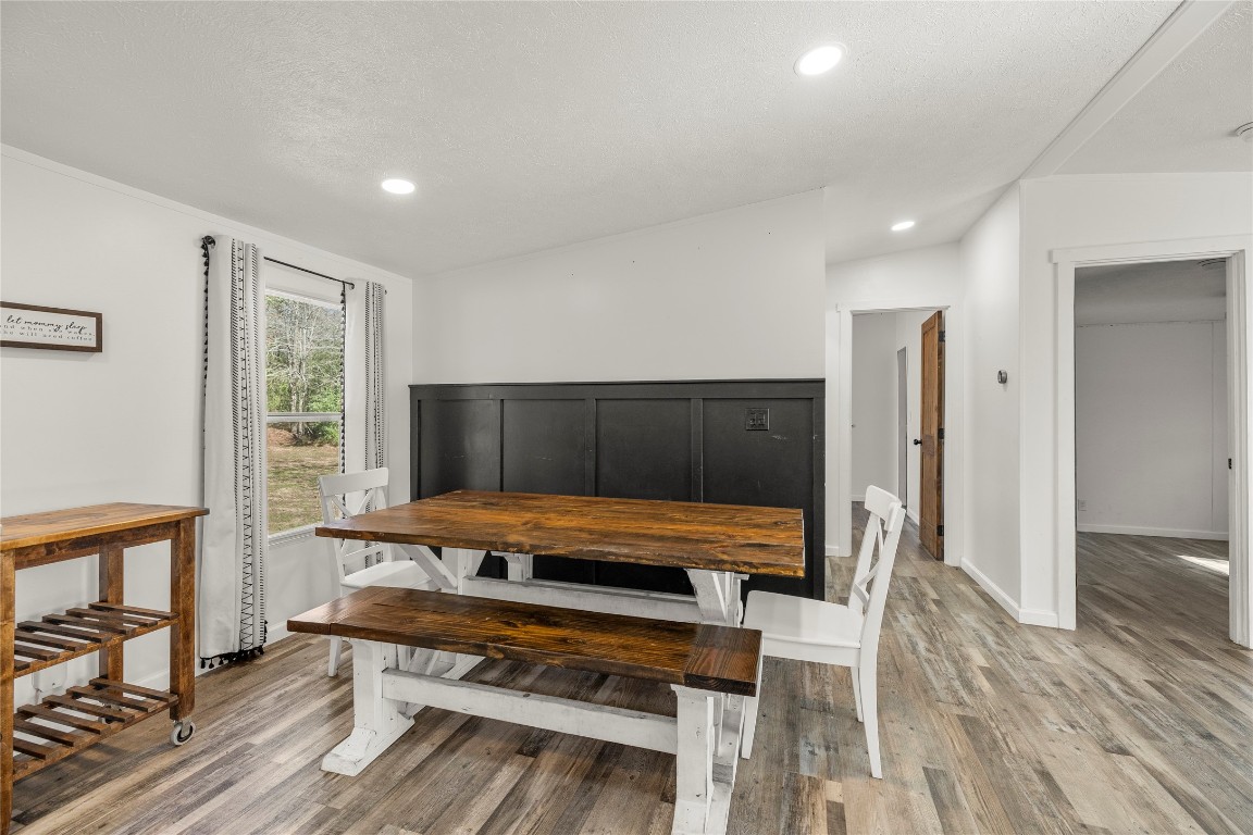 21150 Arnsworth Road Montgomery, TX 77356 - Photo 17 of 35 a sitting area with wooden floor and furniture
