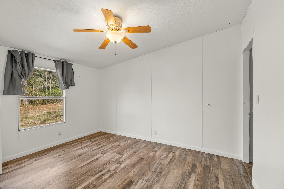 21150 Arnsworth Road Montgomery, TX 77356 - Photo 25 of 35 wooden floor in an empty room with a window