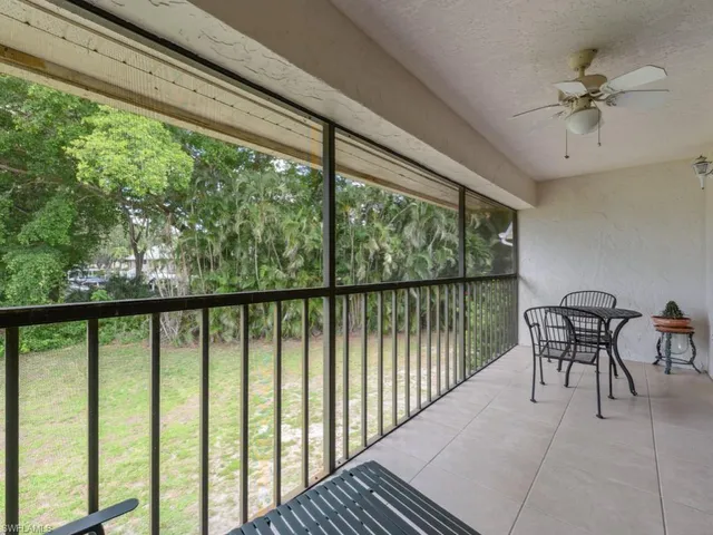 a view of a balcony with furniture