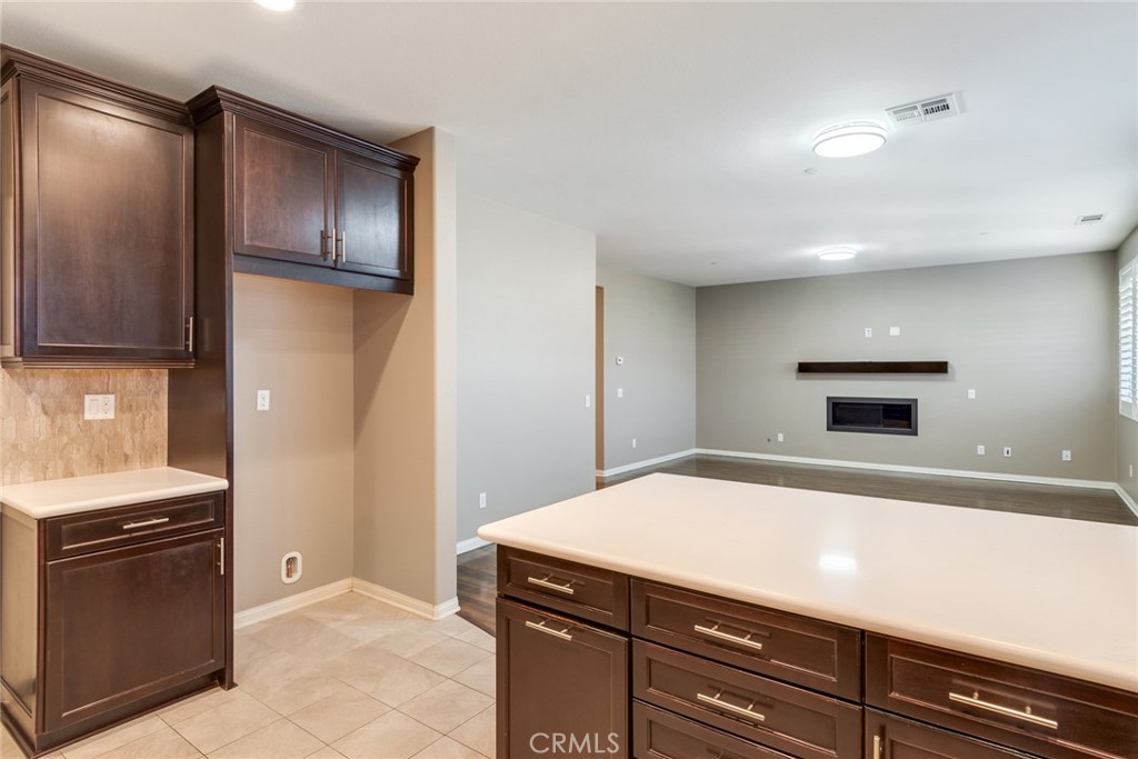 7903 Chaparral Drive Highland, CA 92346 - Photo 11 of 28 a room with a stove and a refrigerator