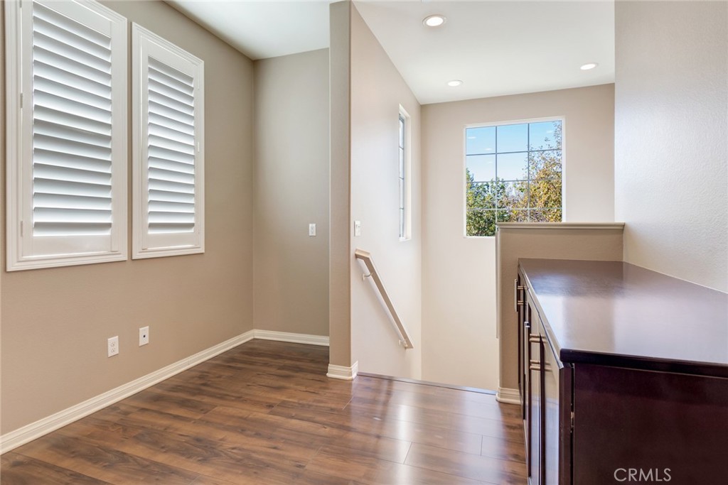 7903 Chaparral Drive Highland, CA 92346 - Photo 15 of 28 a view of a room with wooden floor and a window
