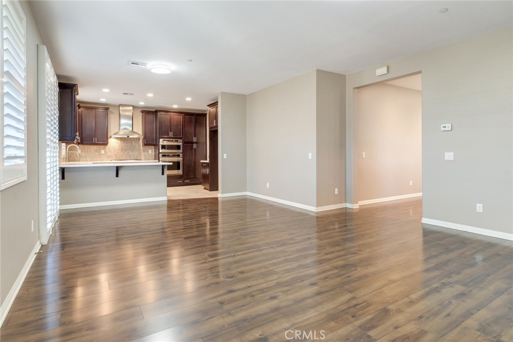7903 Chaparral Drive Highland, CA 92346 - Photo 8 of 28 a view of a kitchen with wooden floor and a window
