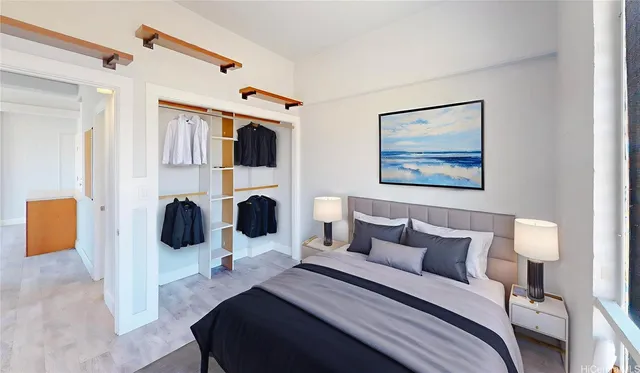 a bedroom with a bed a couch and dresser